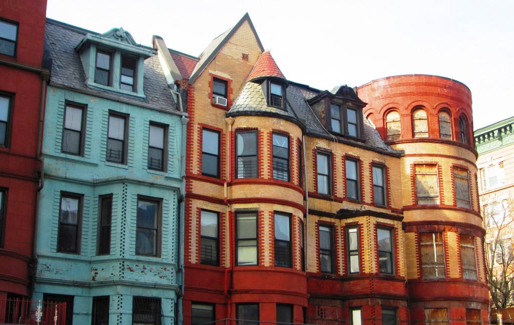 Colorful row houses of various styles in Hamilton Heights